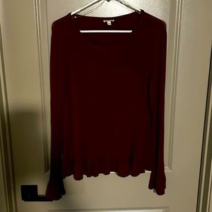 Ruby colored long sleeve tee with ruffle sleeves and hem